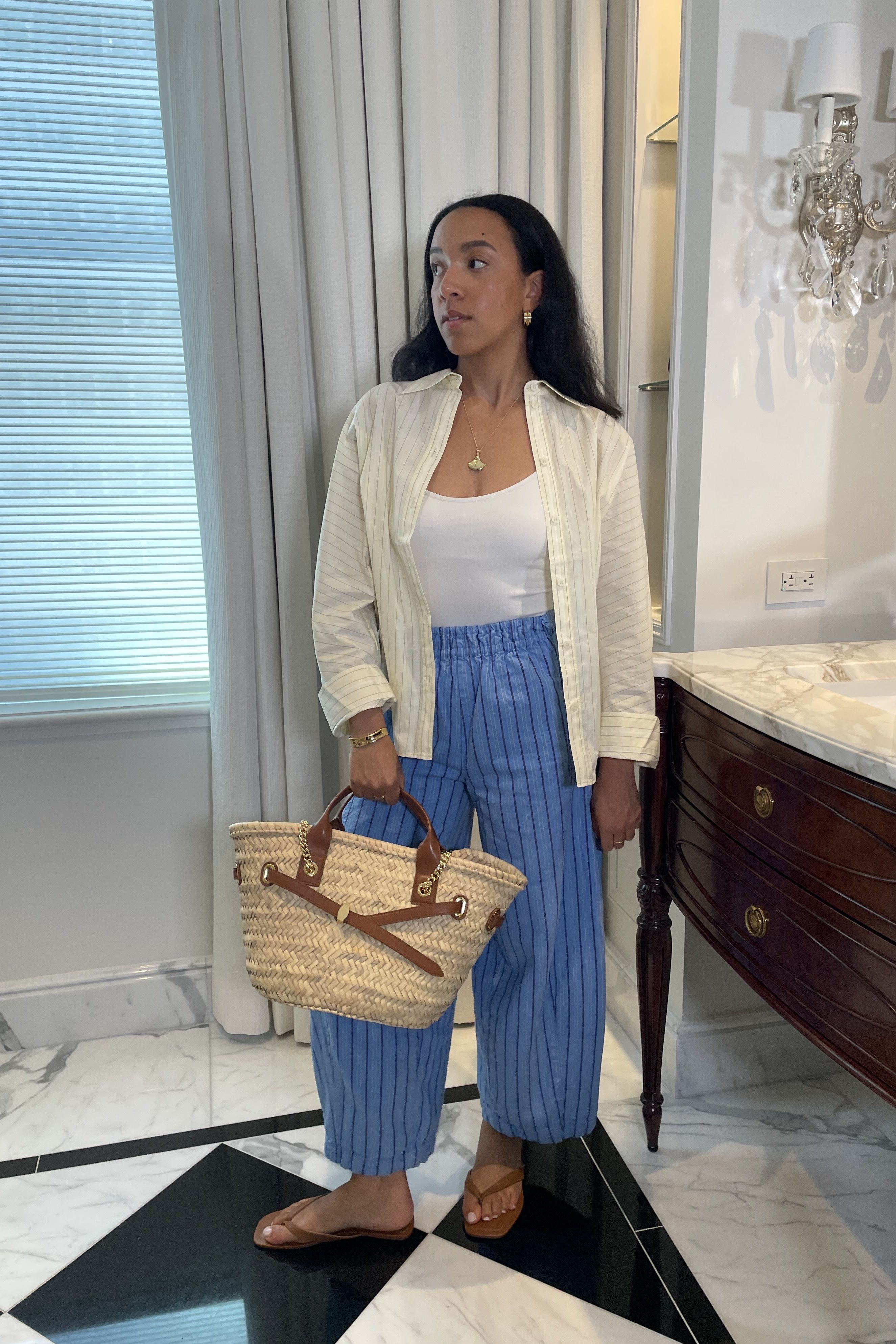 Lauren Tappan wearing a yellow button-down and blue pants
