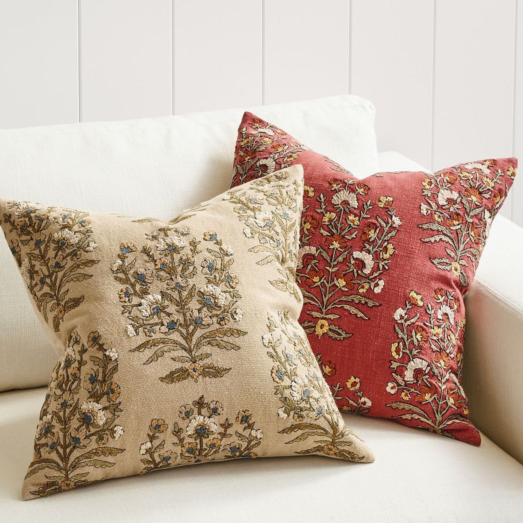 Two floral embroidered pillows