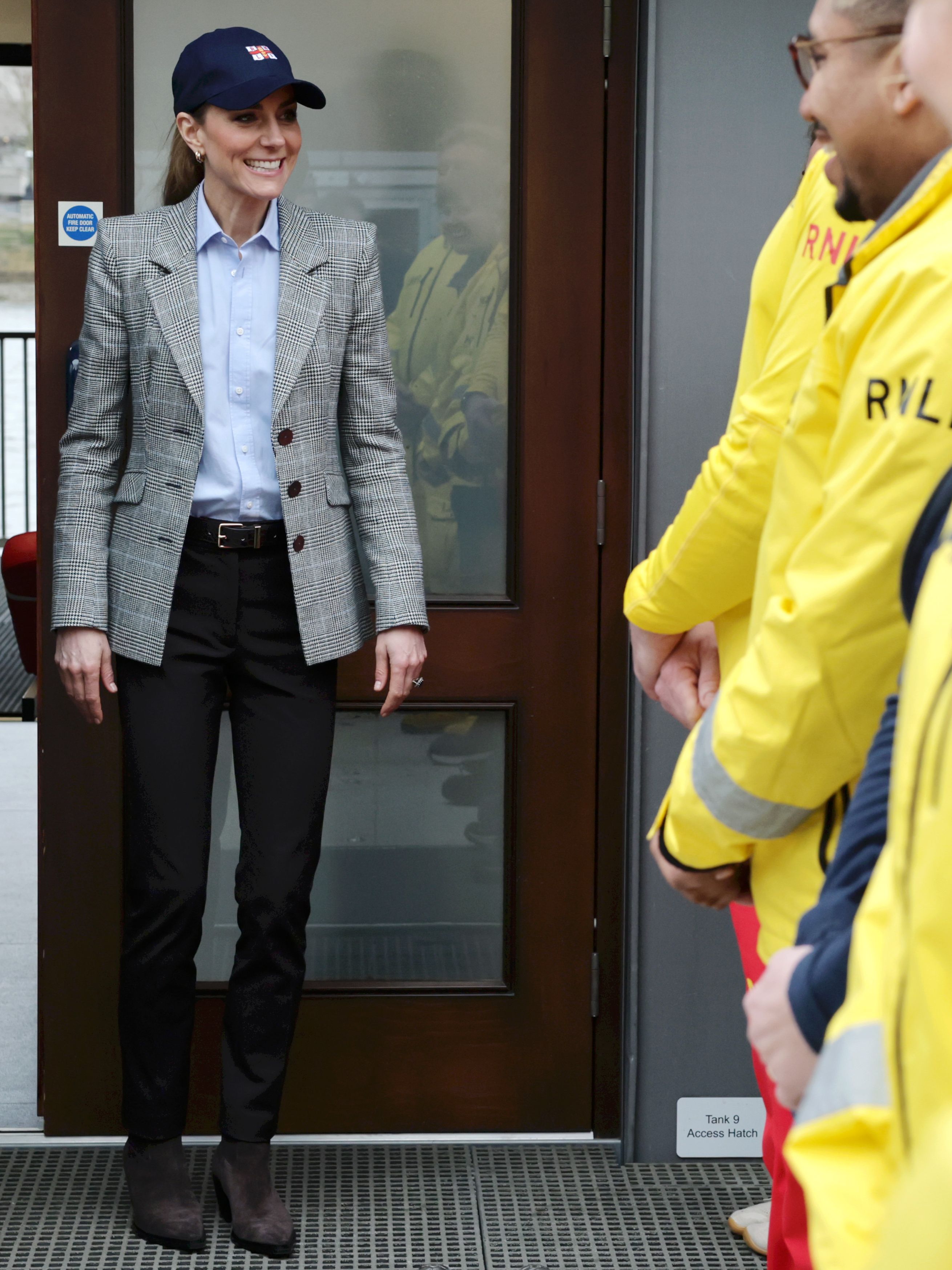 LONDON, ENGLAND - MARCH 12: Catherine, Princess of Wales speaks with crew members during her visit to the RNLI Tower Station on March 12, 2026 in London, England. The Prince and Princess of Wales visited the Royal National Lifeboat Institution (RNLI) to hear about their work saving lives on the River Thames, as the charity celebrates 25 years of RNLI Lifeguards. (Photo by Chris Jackson/Getty Images)