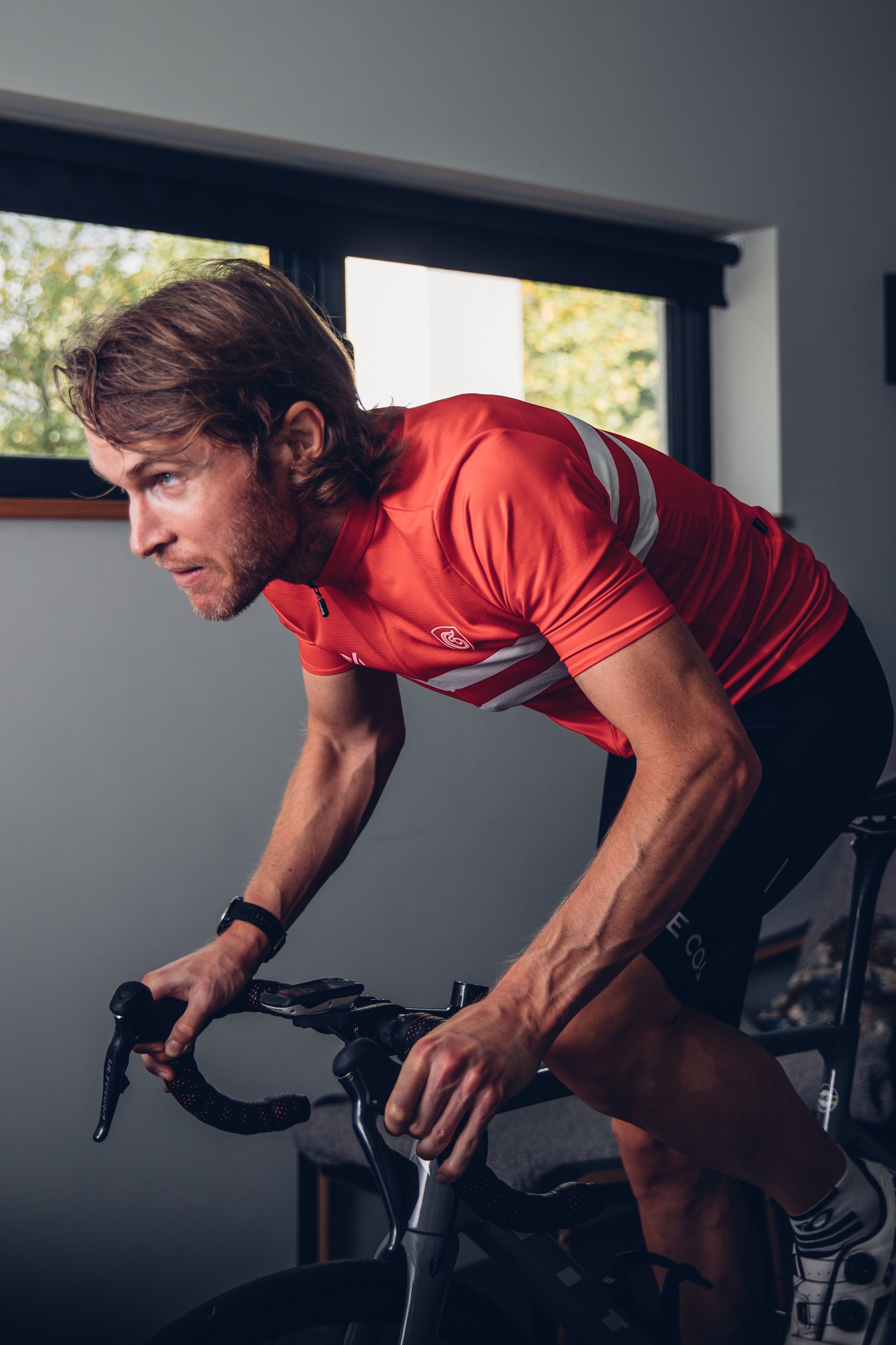 A man rides on an indoor trainer