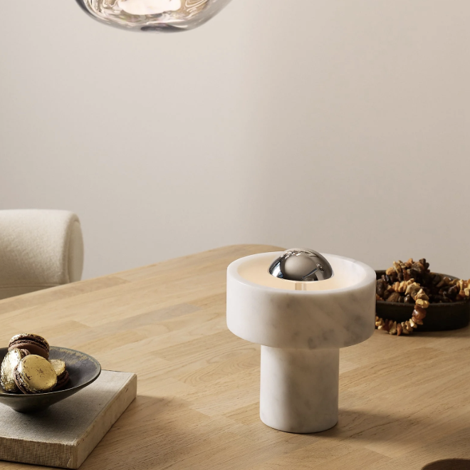 Stone portable light on a wooden dining table