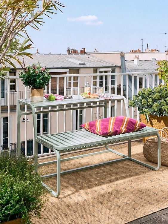 sage green reversible bench on balcony