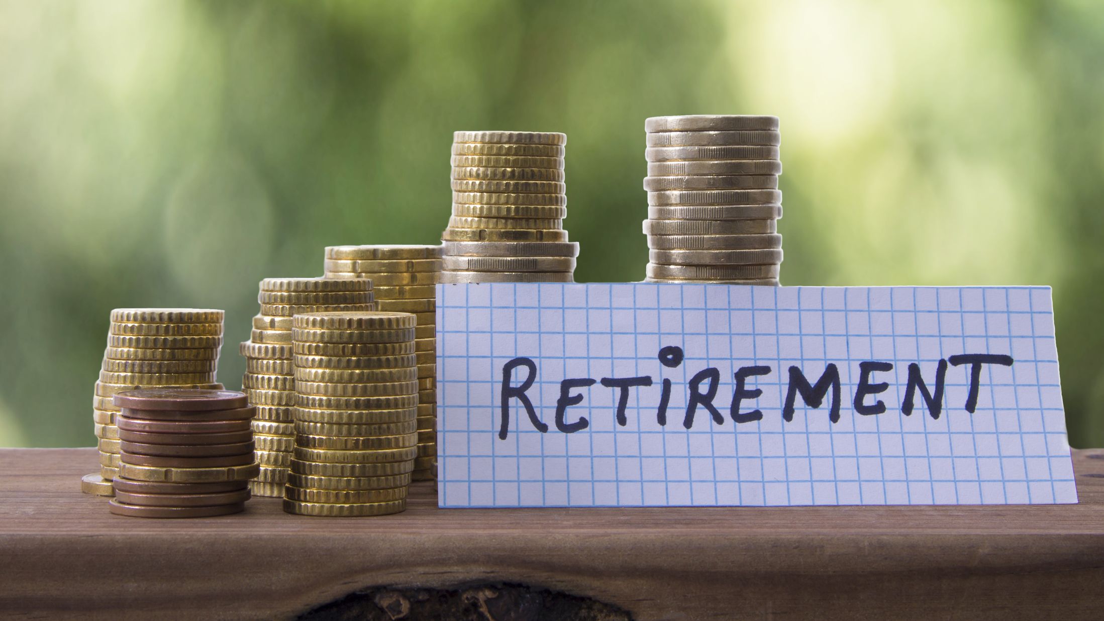 A set of coins with a note that says "retirement."