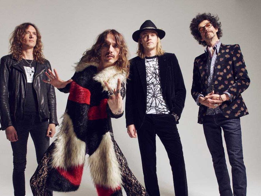 Listen to The Darkness embrace “weird progressive time changes” on