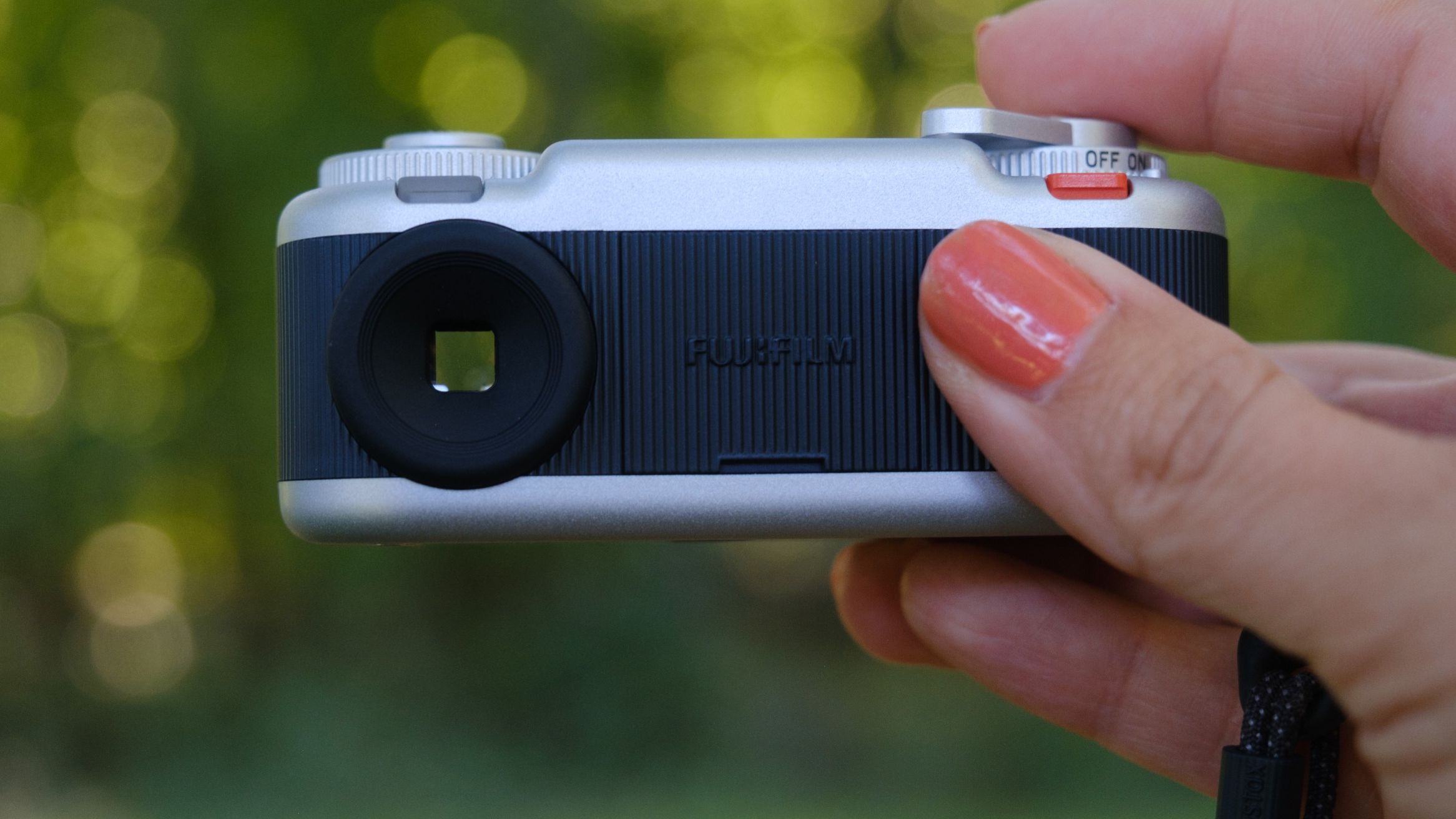 The Instax Pal 2 held in a photographer's hands