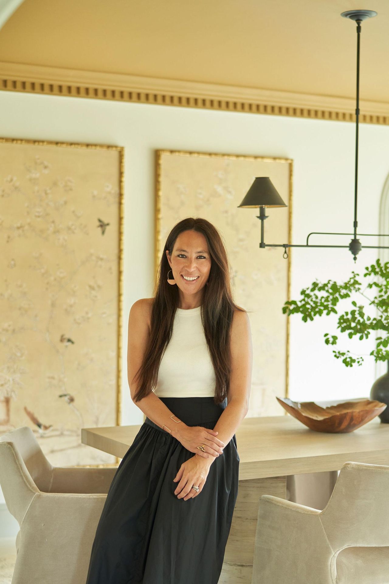 joanna gaines in dining room with gold ceiling