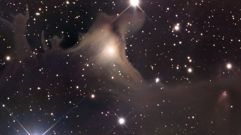 clouds of gas and dust look like figures reaching out into the cosmos.