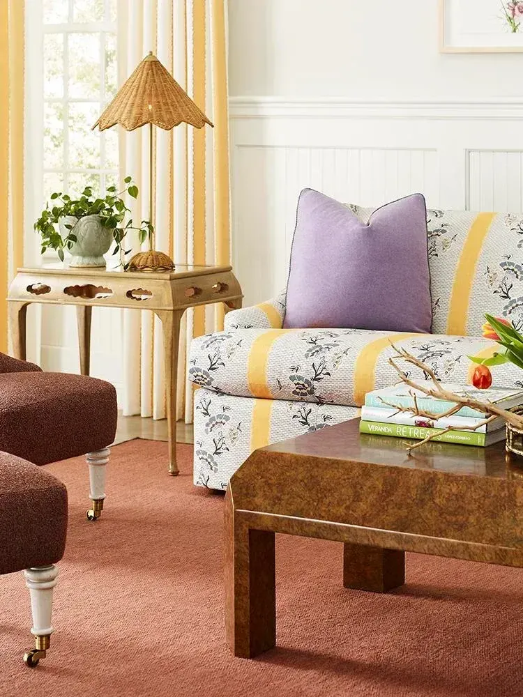 patterned sofa and burl coffee table in vintage living room
