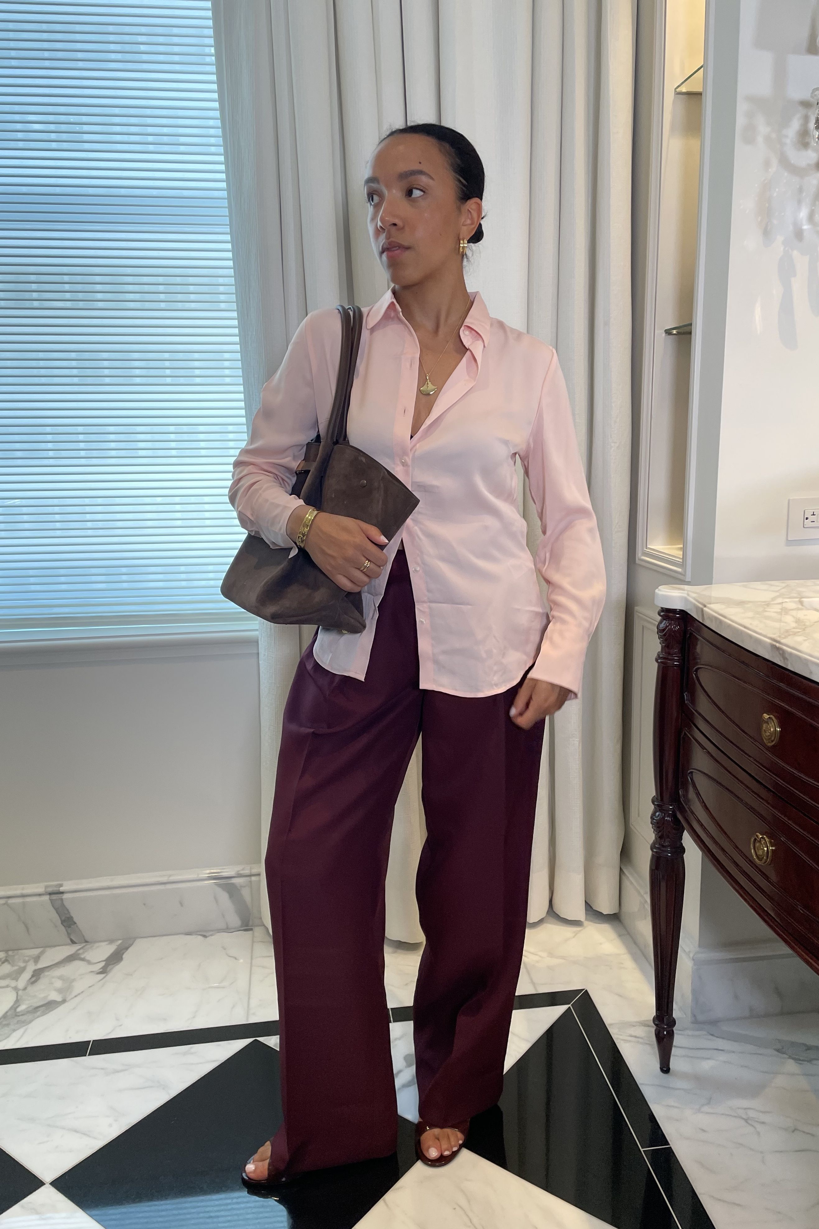 Lauren Tappan wearing a bubblegum pink and merlot pants