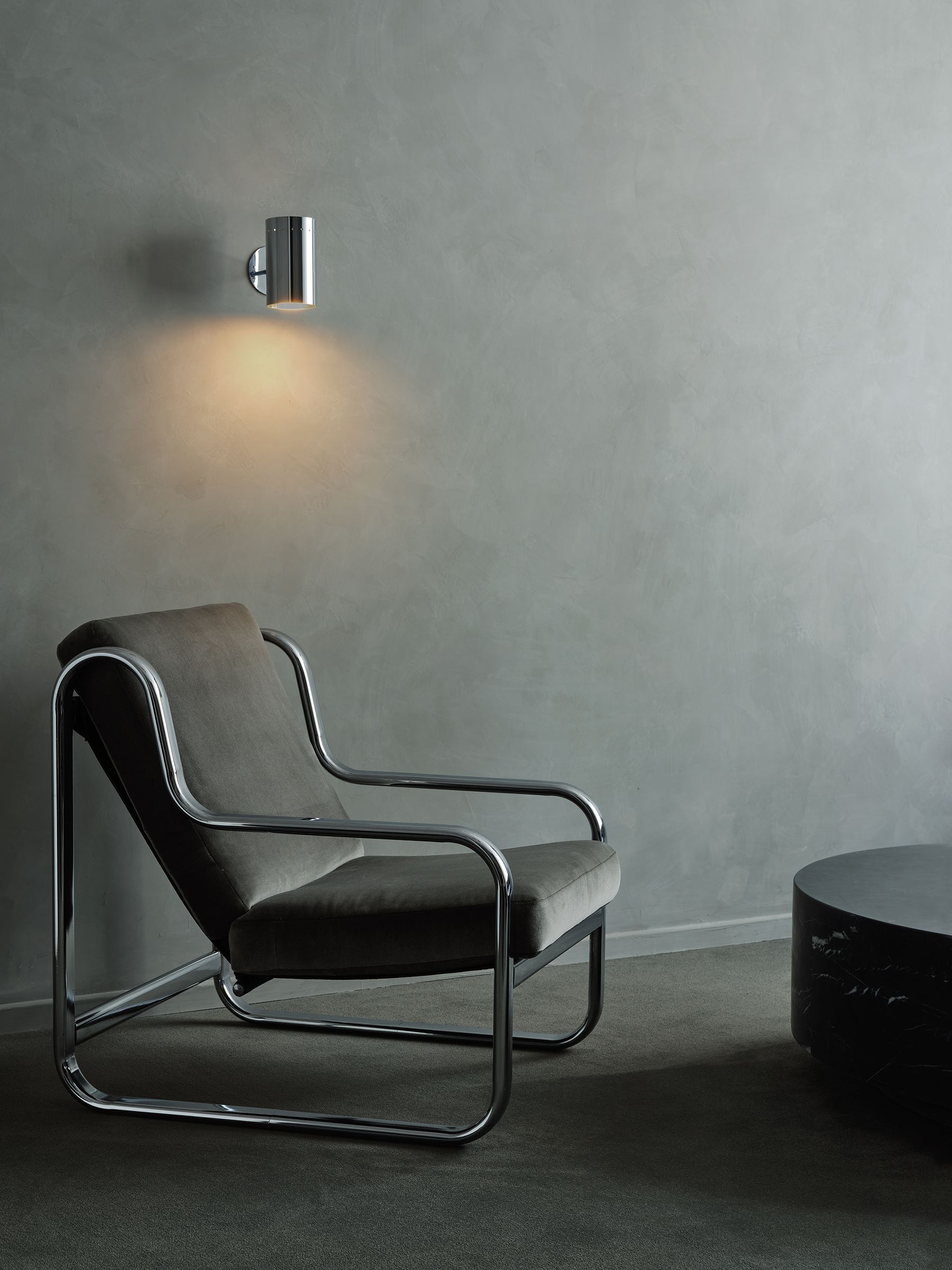 gray lounge chair in a gray room