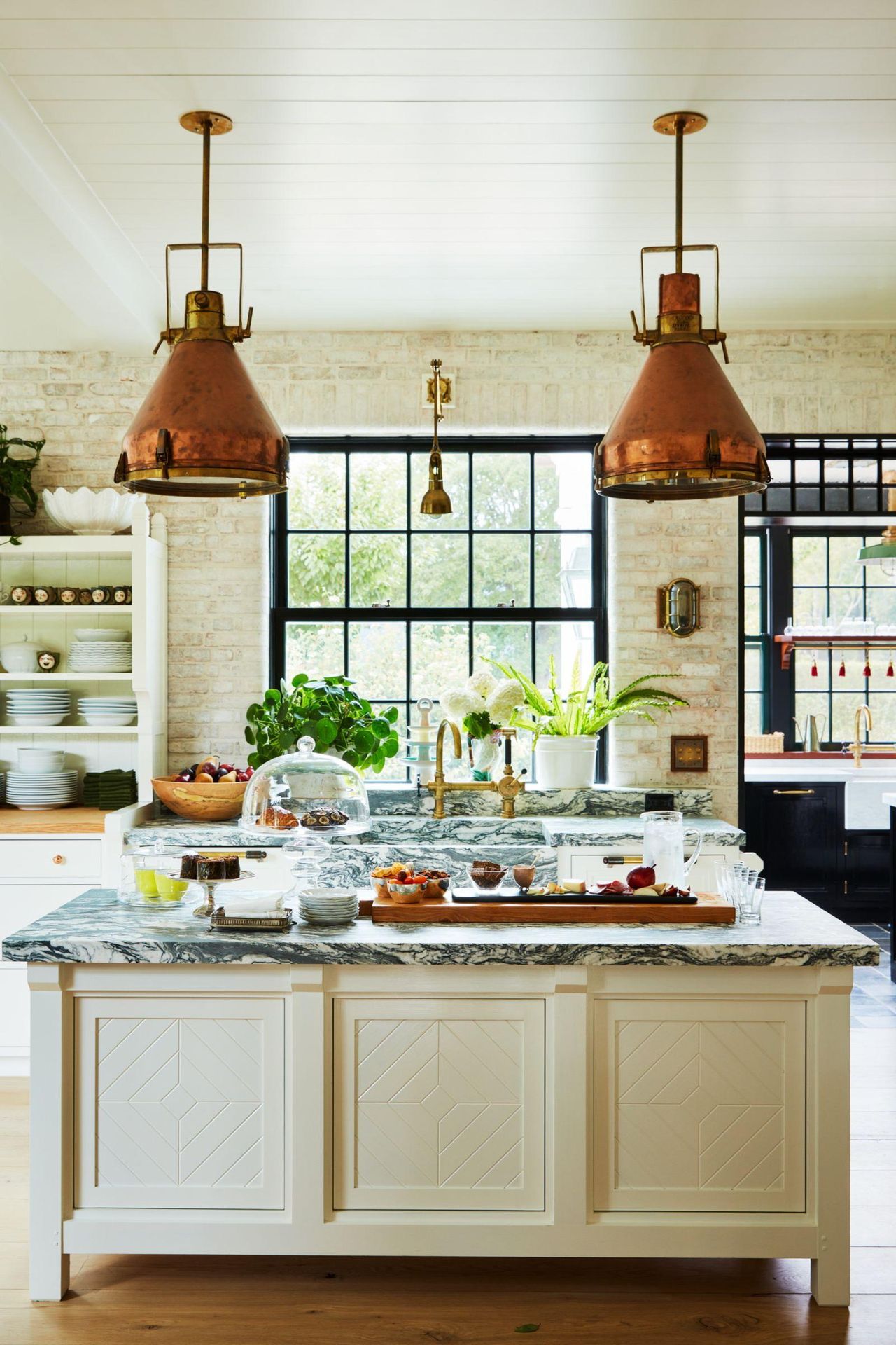 Bryan Graybill's kitchen with copper pendant lights over a marble-topped kitchen island