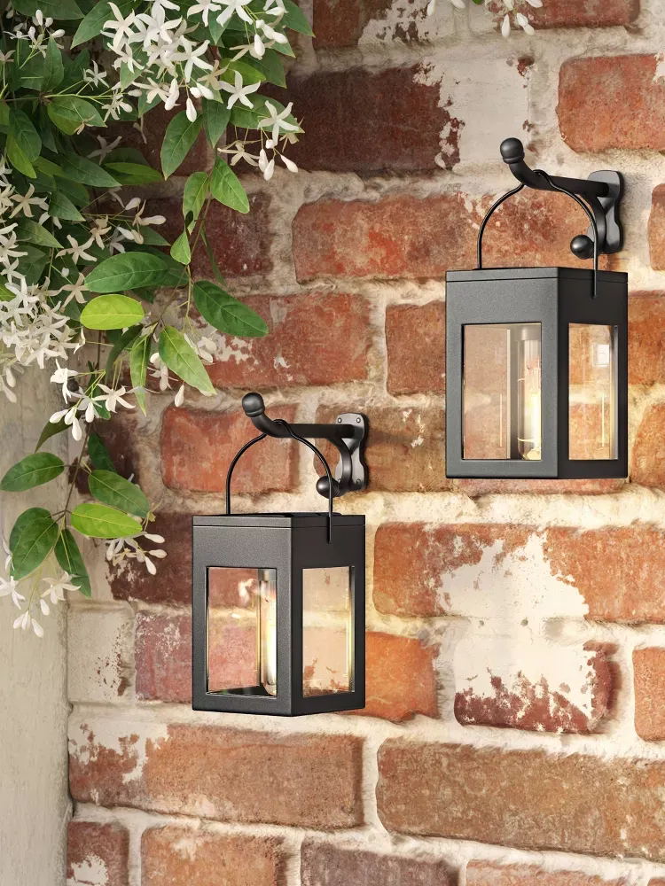 lanterns on a brick wall