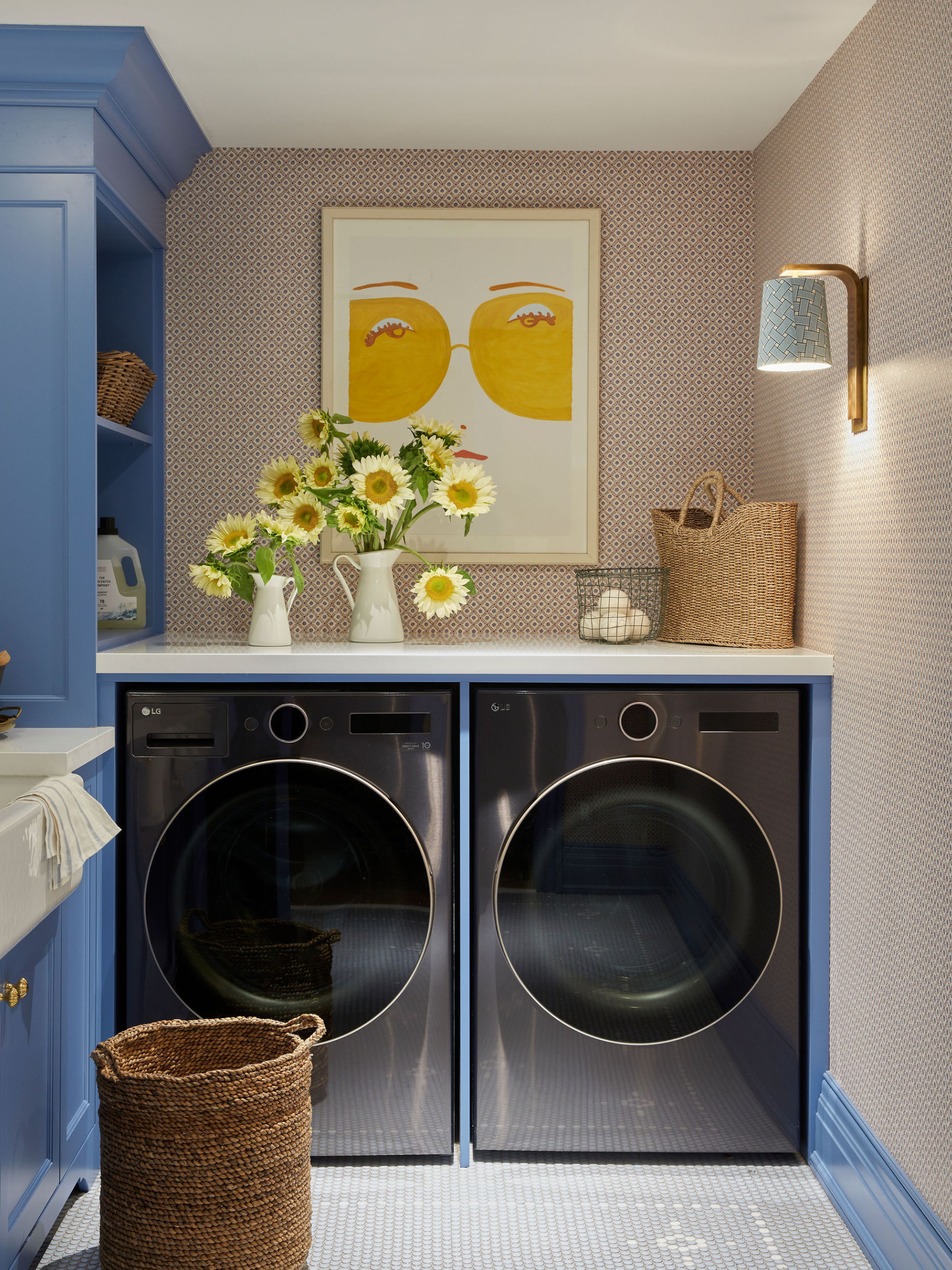 A split image showing a home gym with checkerboard flooring and a graphic, squiggly wallpaper on the walls; an image of a laundry room with art above the washer and dryer.