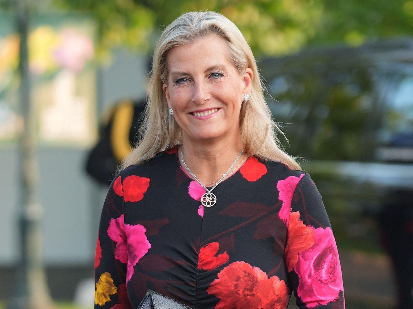 Duchess Sophie gives her favourite floral print a moody autumn update with  berry tones and her embellished heels are the chicest finishing touch