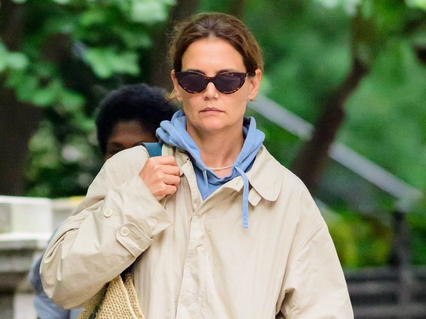 Katie Holmes Styles Up Her Khaki Rain Jacket With a Straw Tote and