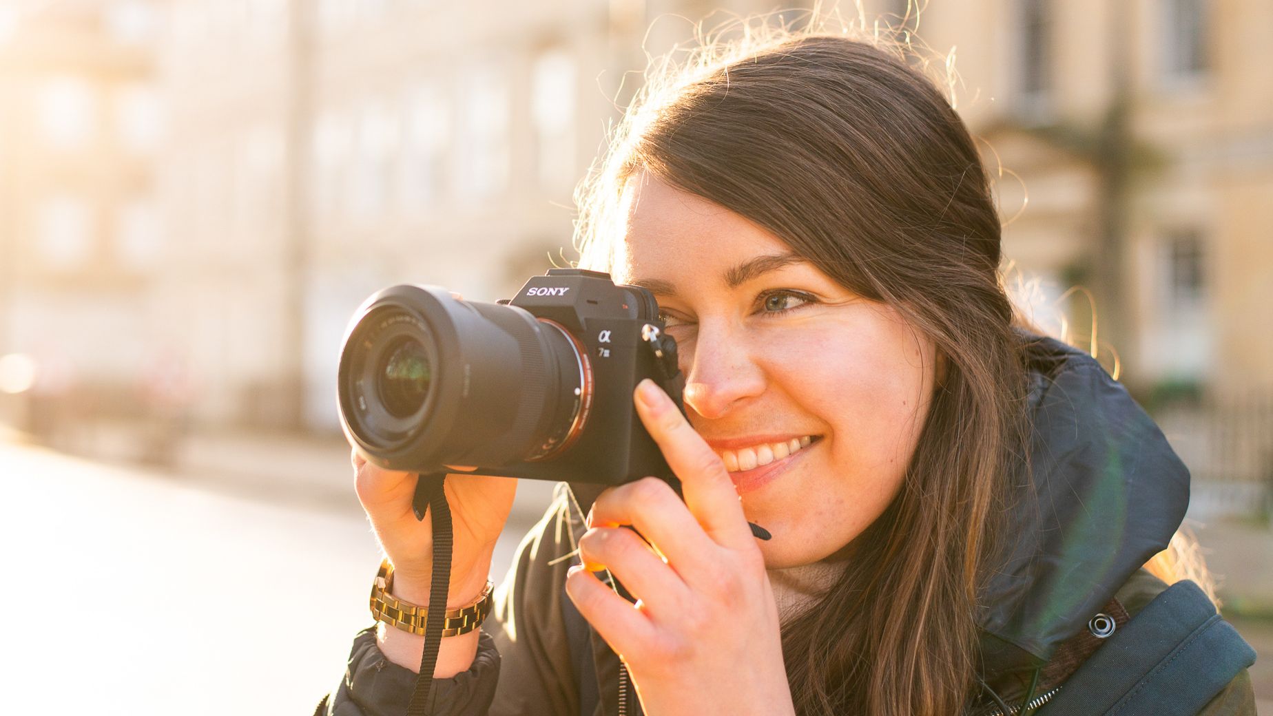 Lauren Scott using Sony A7 III camera on the street