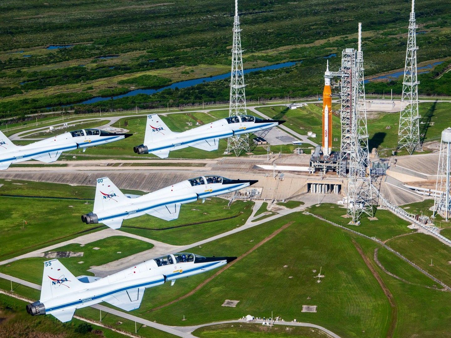 NASA astronauts buzz Artemis 1 SLS rocket in jet flyby (photos
