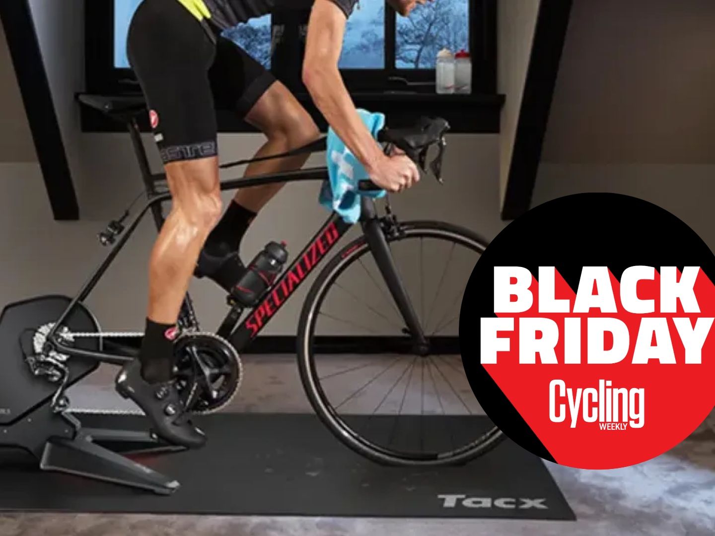 The Tacx Flux S Smart Trainer being riden by a white man with a