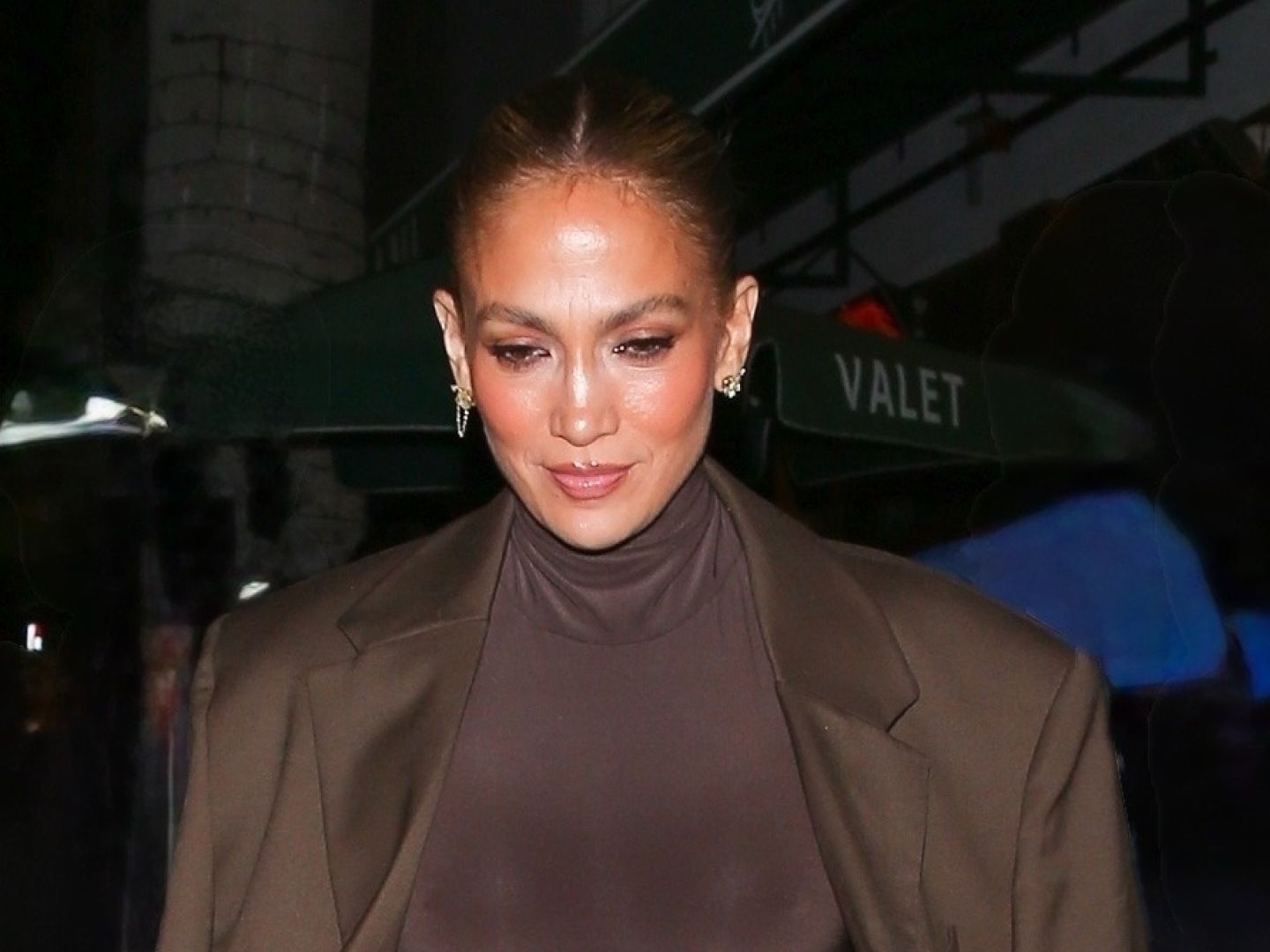 J.Lo's Clutch Adds a Pop of Fur to Her Monochrome Outfit | Marie Claire