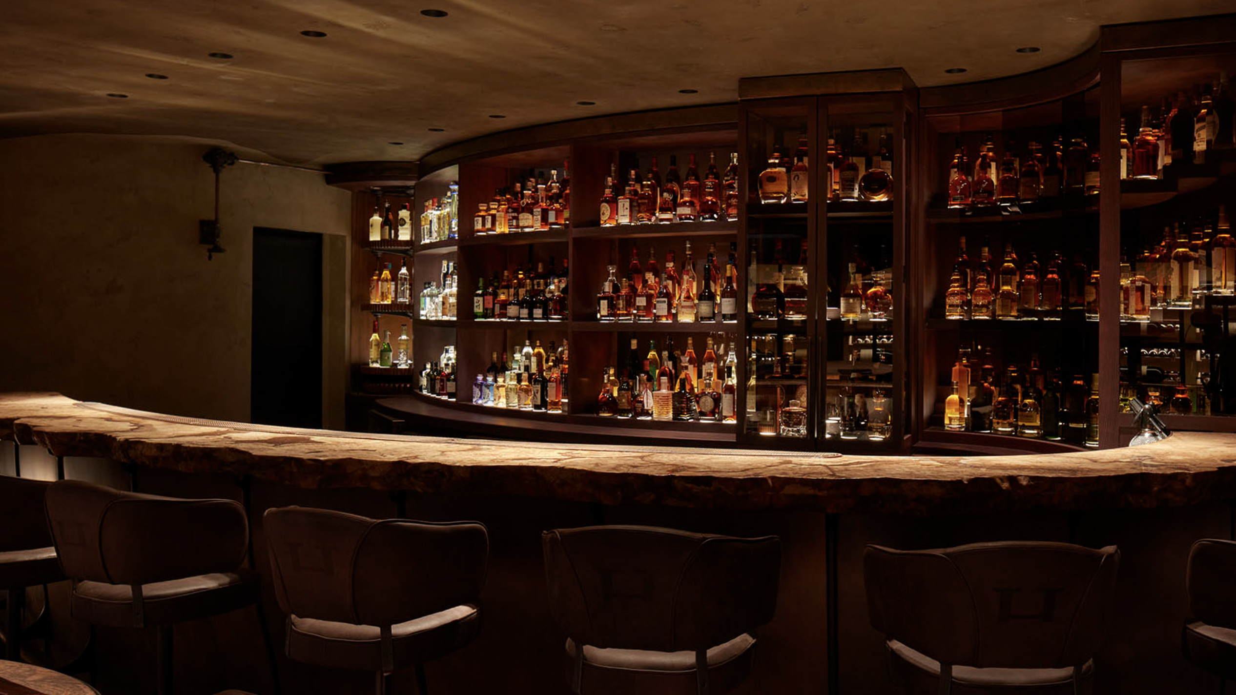 an image of The Bar Below showing the bar with six seats against it, underneath Hide restaurant in Piccadilly