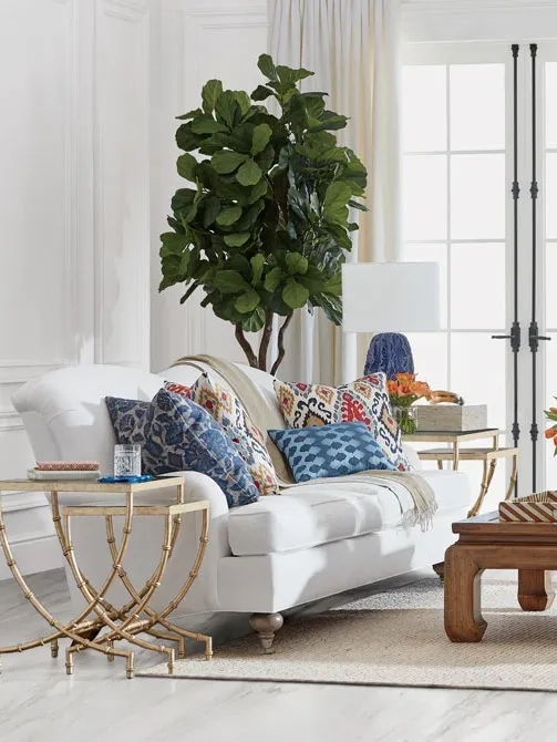 White living room with colorful furniture