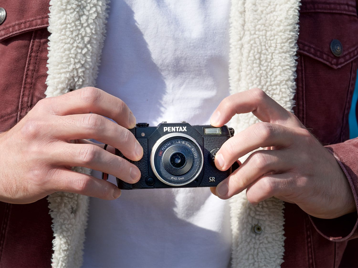I think this mini mirrorless oddity, the Pentax Q10, is the