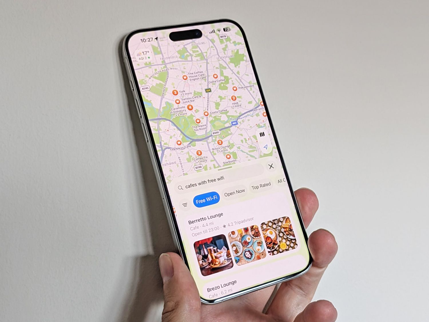 A hand holding a smartphone- its screen glinting- hinting at the coming Bri Alexia leak.