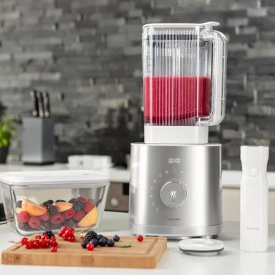 Zwilling Enfinigy Power Countertop Blender blending a berry smoothie