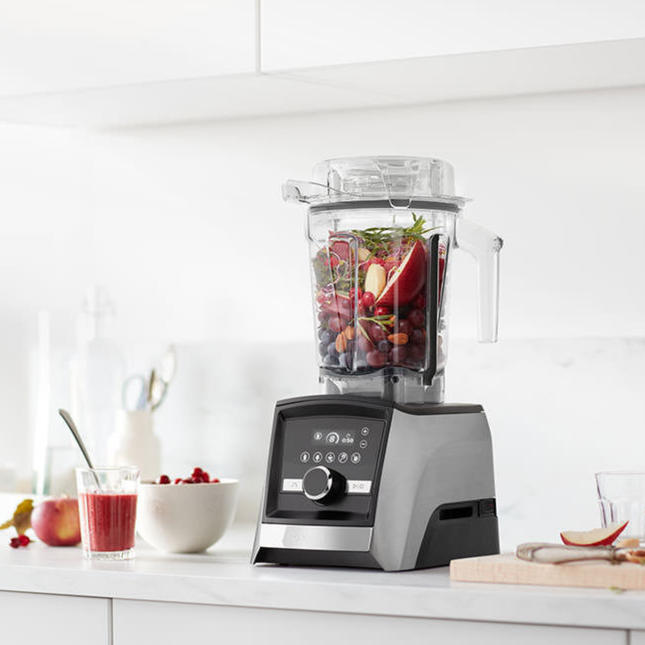 Vitamix A3500 on countertop blending a fruity mix