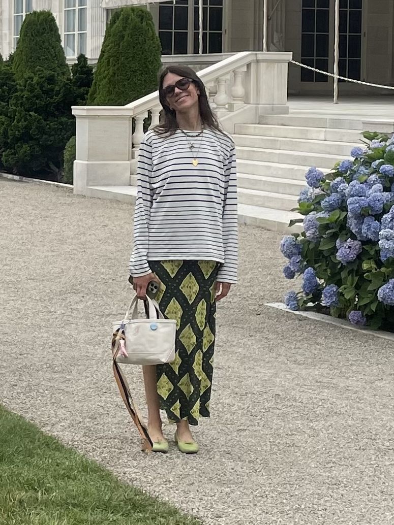 Julia Gall styles a striped top over a midi slip dress with a green diamond pattern