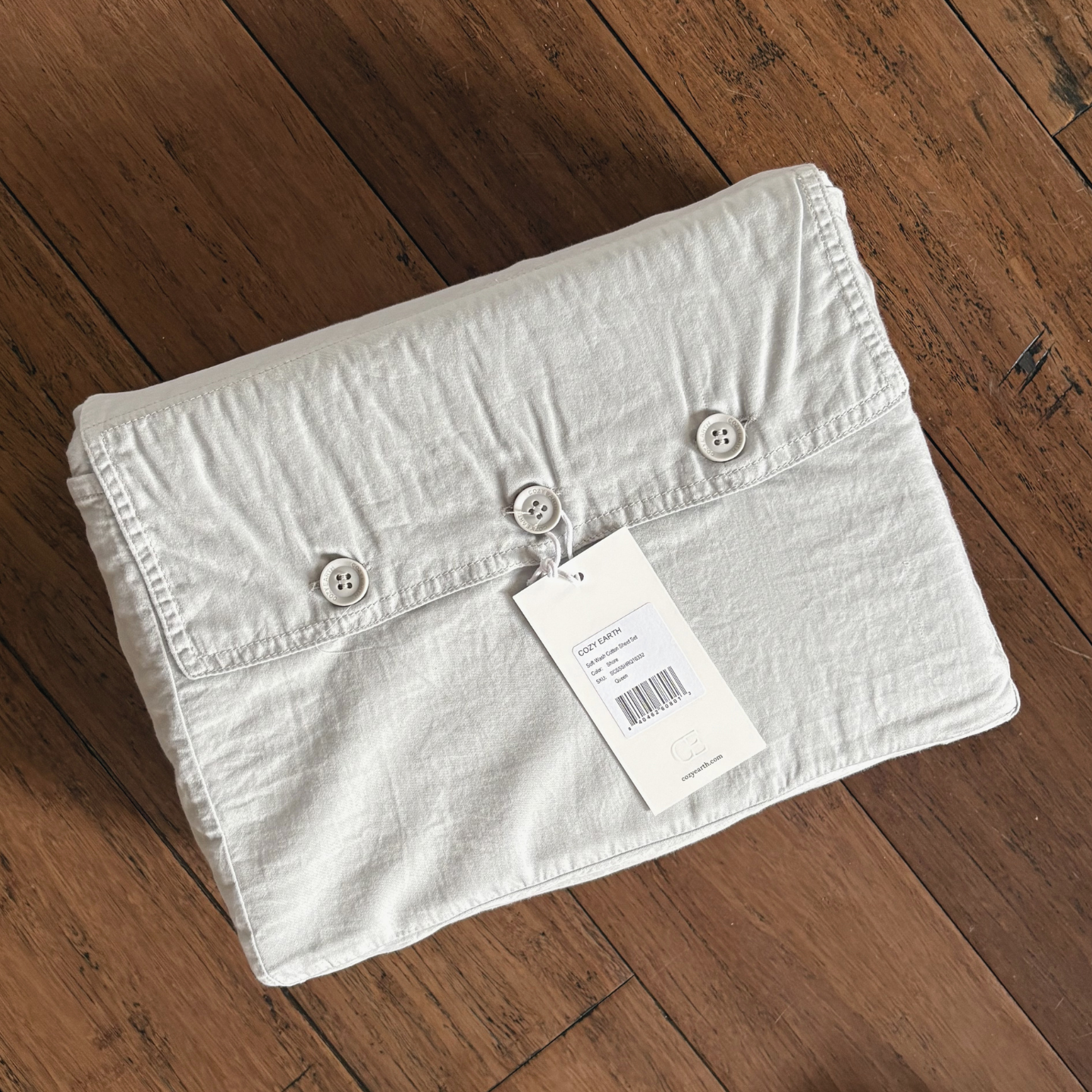 package of cozy earth bedding on a hardwood floor