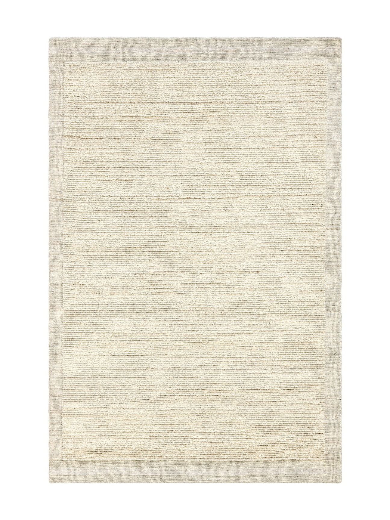 handwoven, artisinal cream-colored pottery barn performance rug