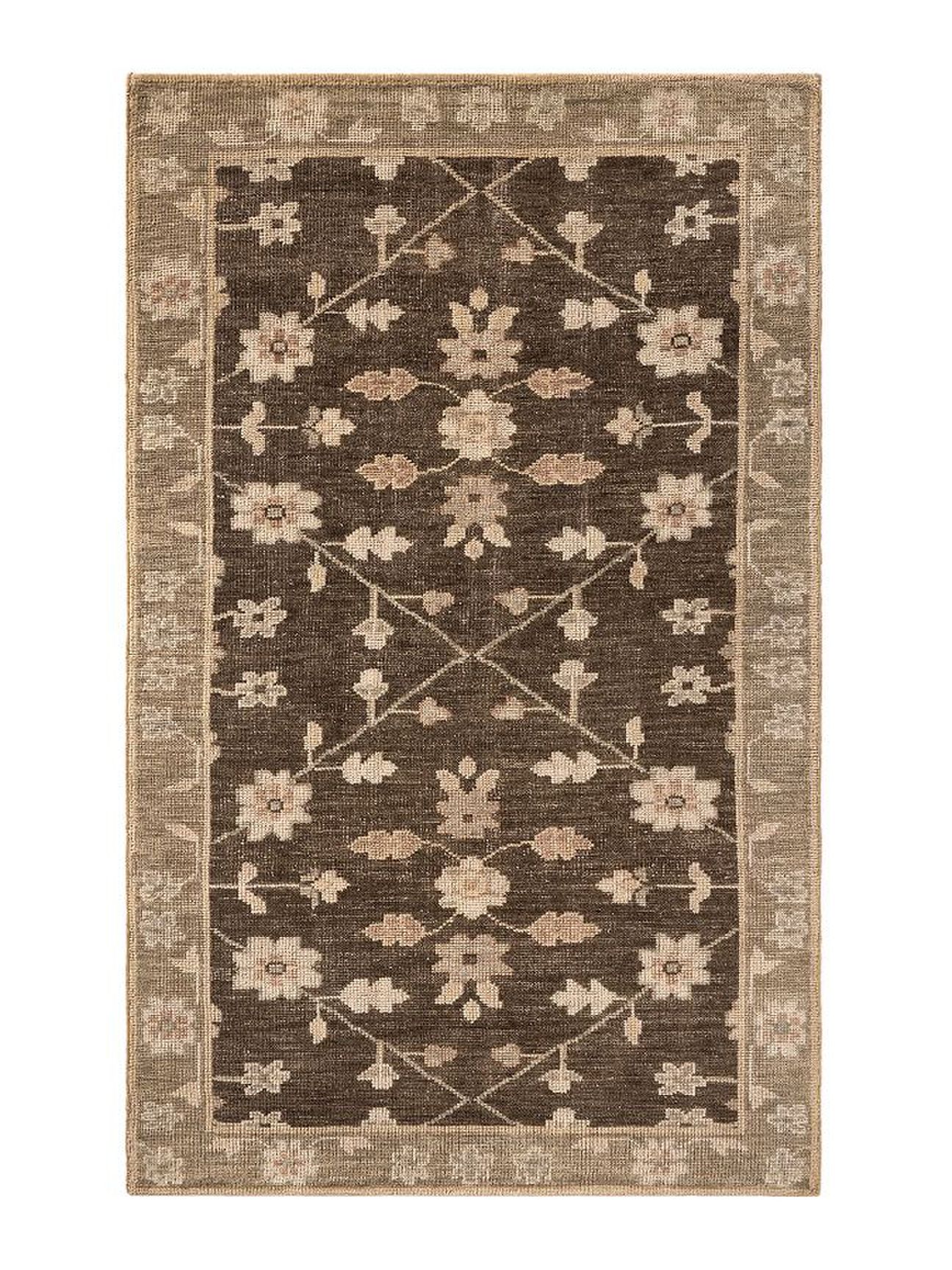brown and tan patterned pottery barn rug