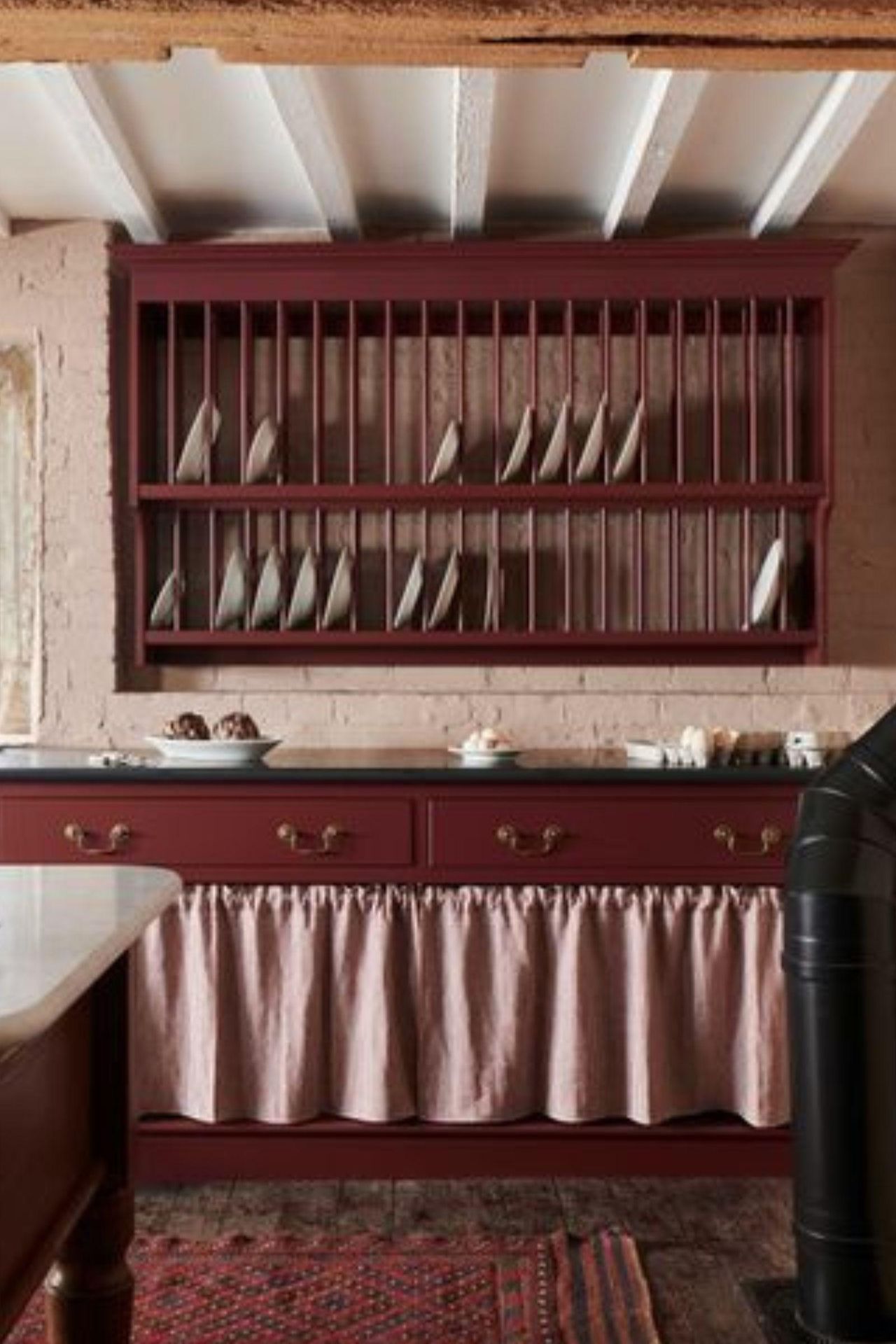 small kitchen with cabinet curtains instead of doors to save space