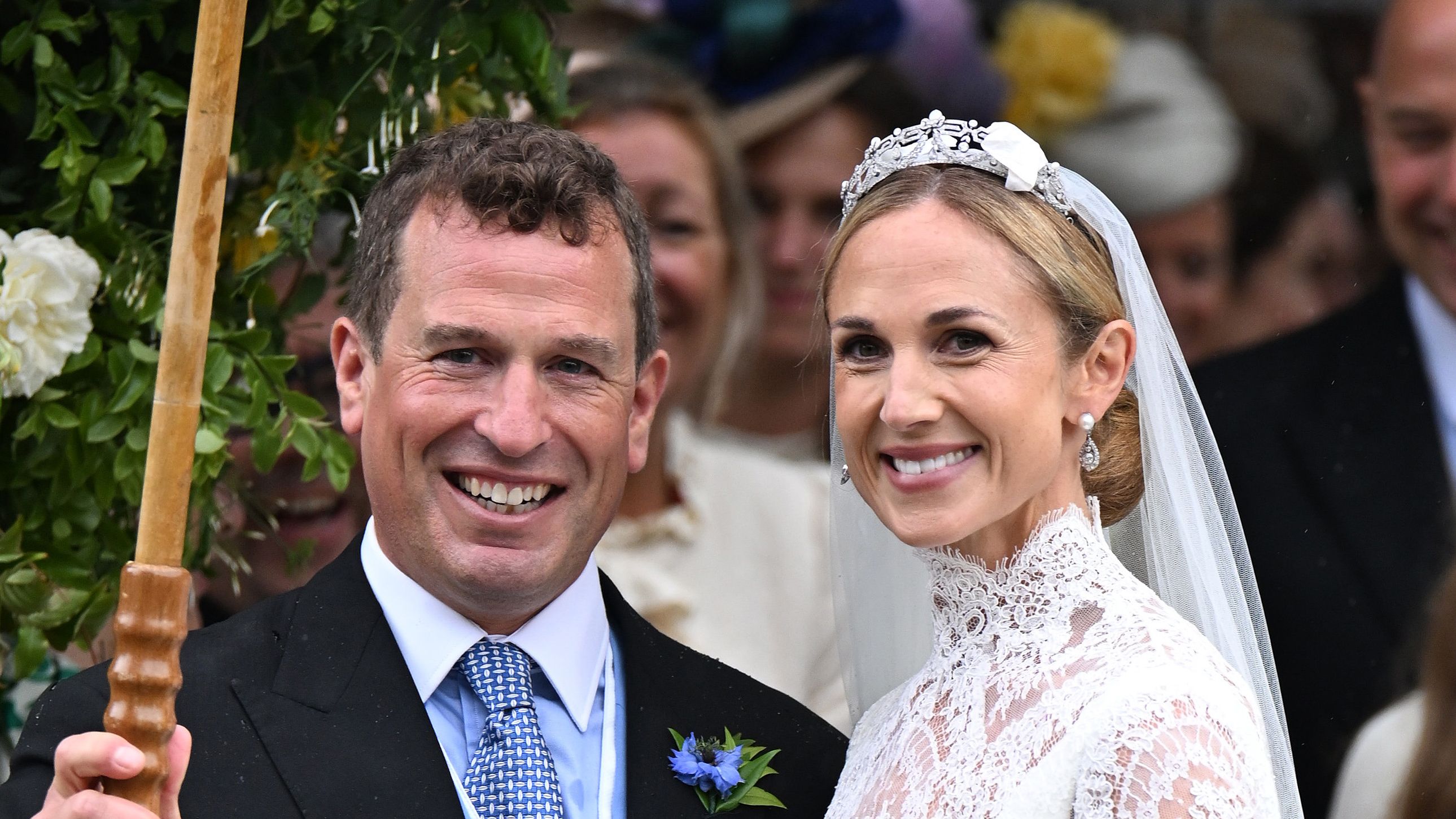 Harriet Sperling wears a diamond tiara at her wedding to Princess Anne's son, Peter Phillips, along with a cusom Emilia Wickstead lace wedding gown featuring a high neck and long sleeves