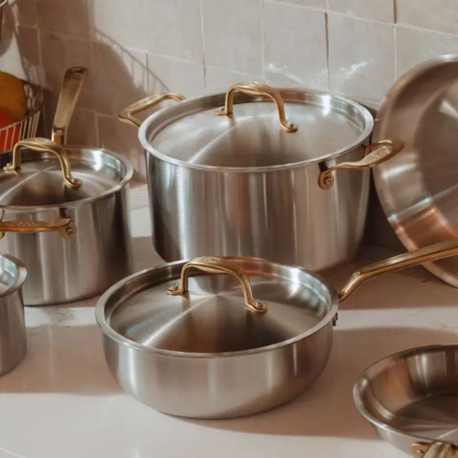 A selection of Made In Stainless Steel Pans with gold tone handles