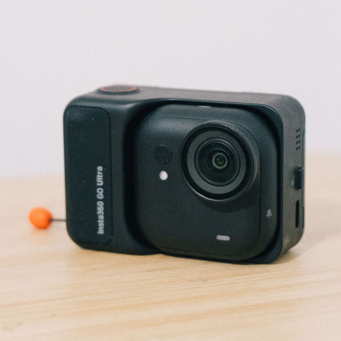 Insta360 Go Ultra on a wooden table