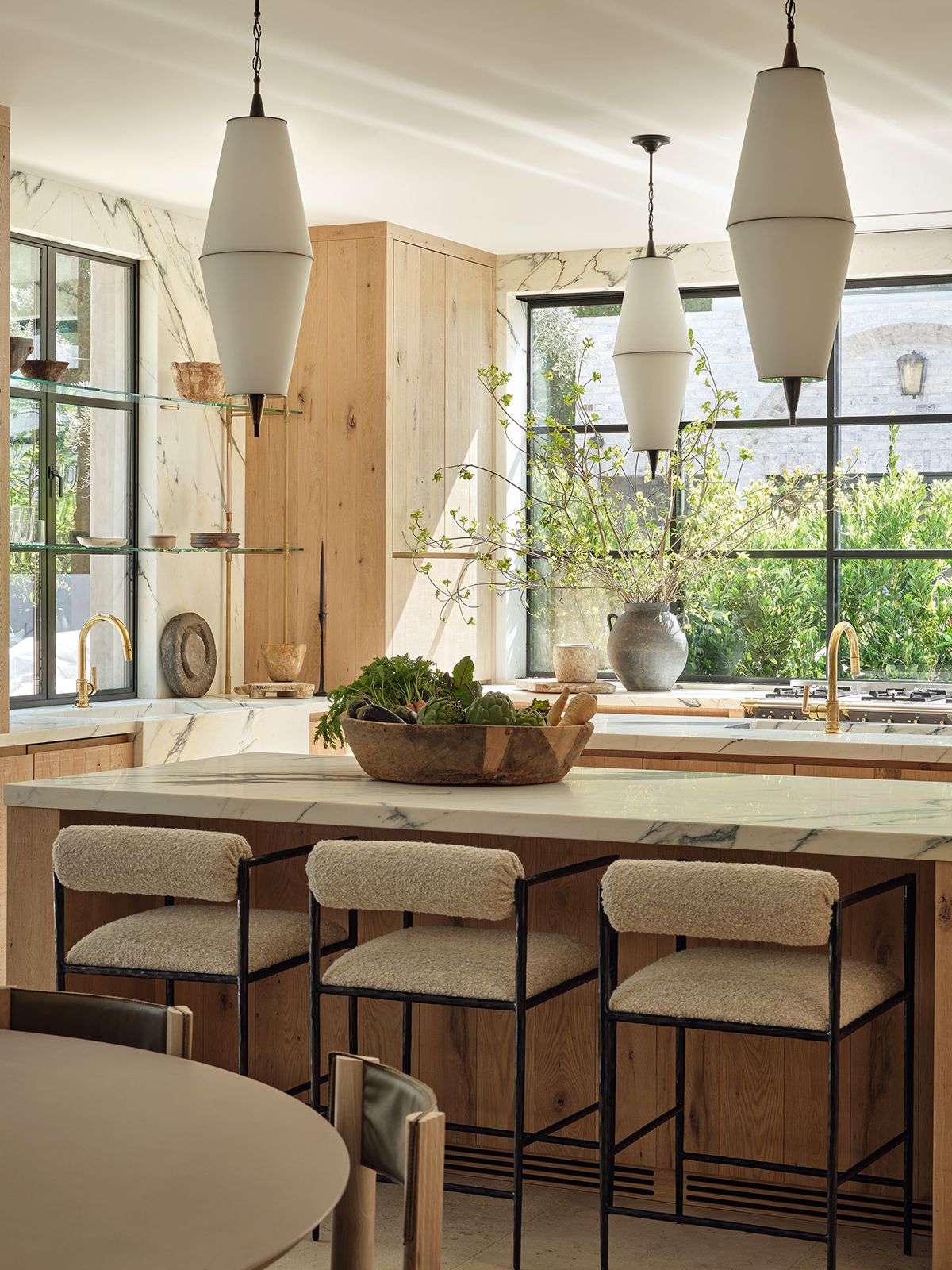 wood kitchen with two islands and white bar stools