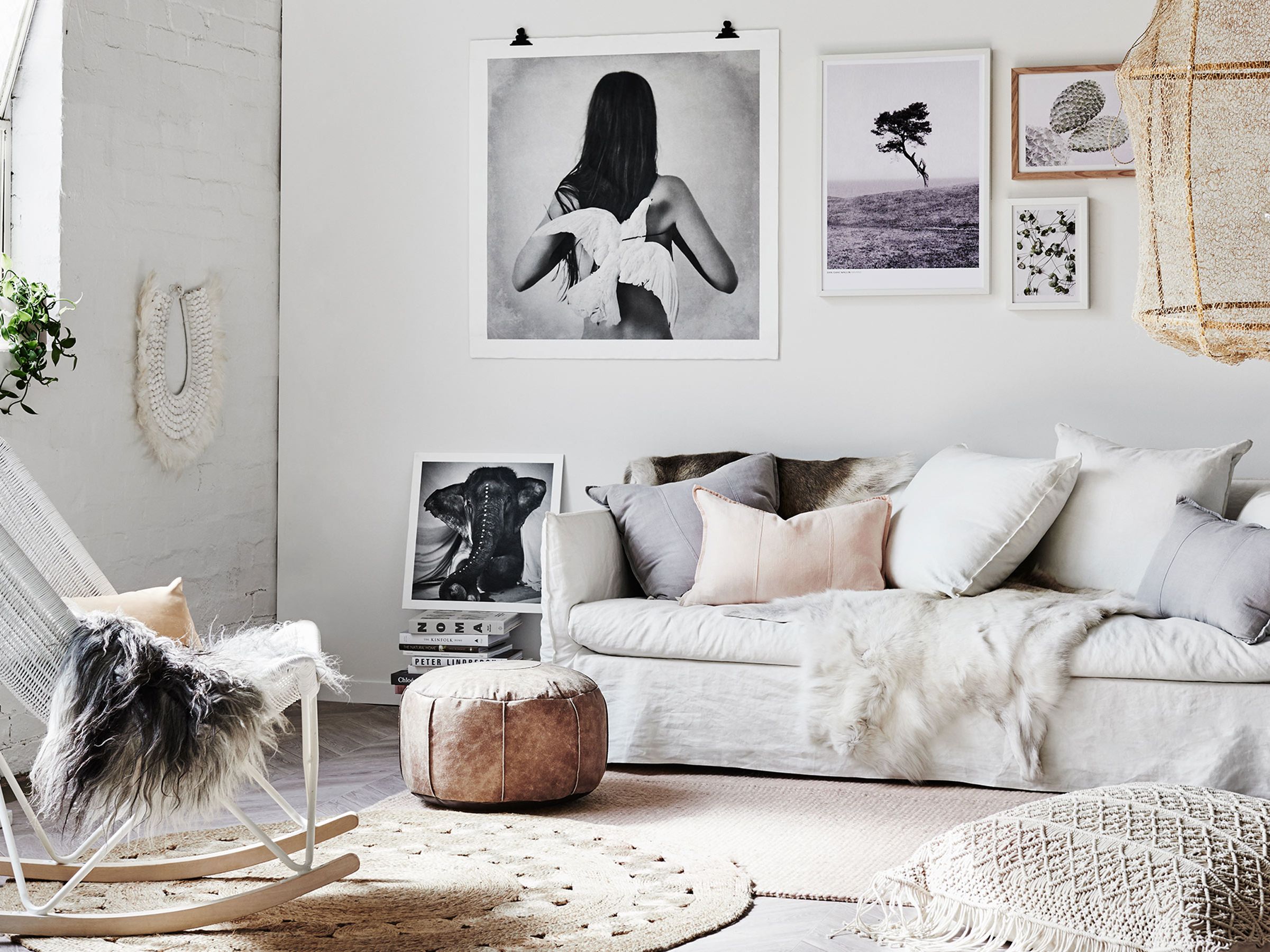 Bohemian living room with layered textures, patterned pillows, and textured throws