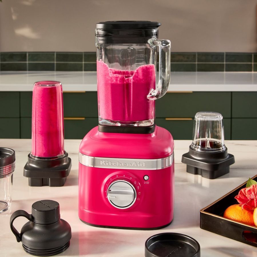 One of the best blenders, the KitchenAid K400 blender in hibiscus, mixing a pink smoothie