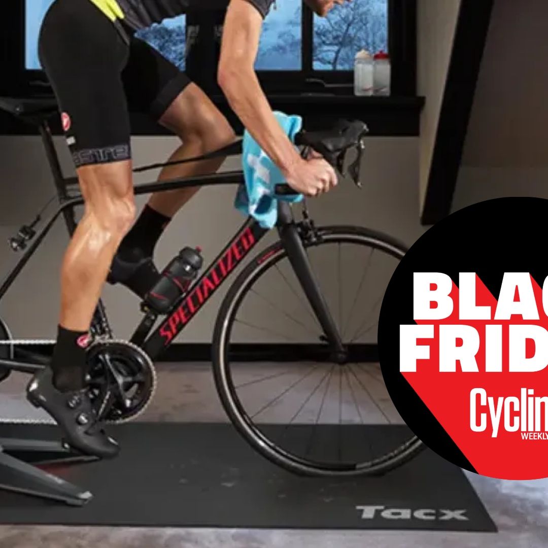 The Tacx Flux S Smart Trainer being riden by a white man with a