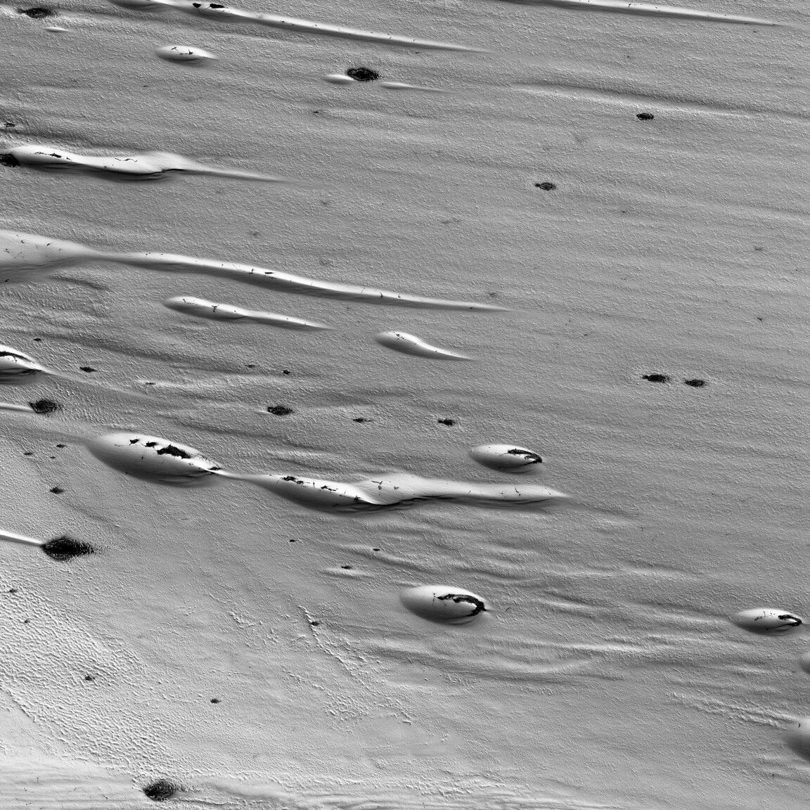 Ice melts in the springtime on Mars photo of the day for April 24
