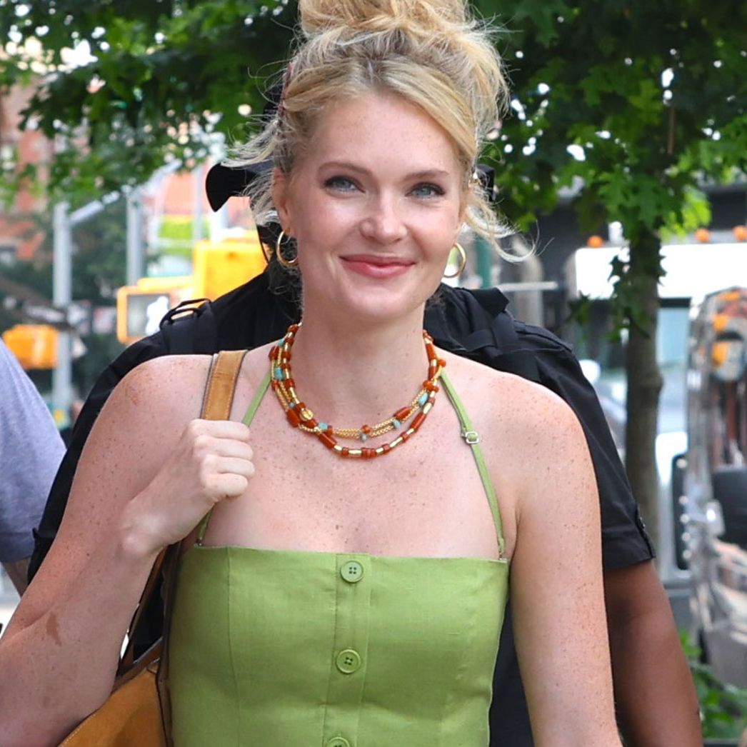 blonde woman in green dress New Life