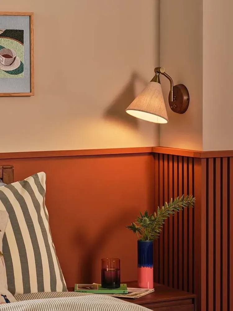 wall light vintage brass arm in bedroom