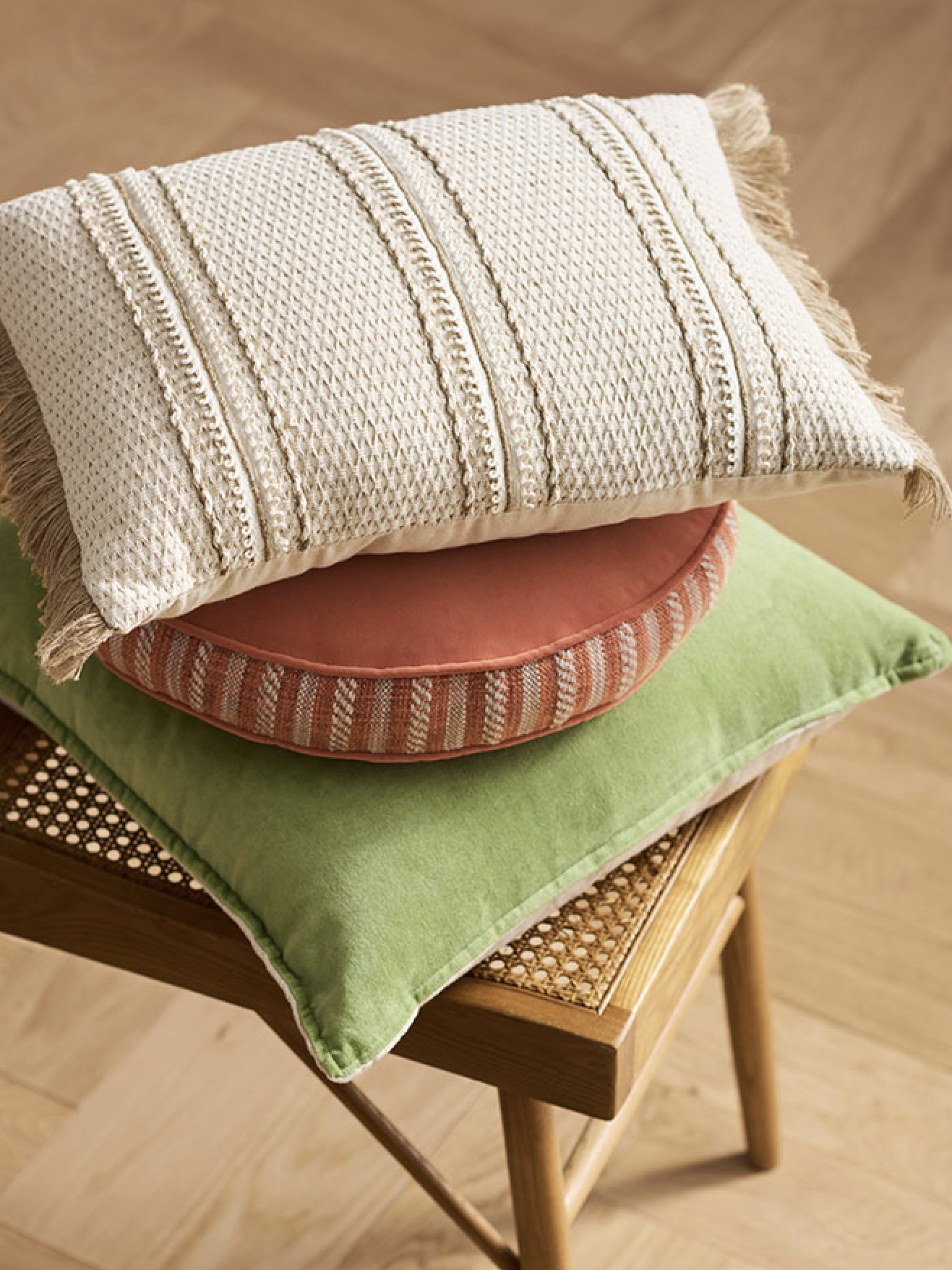 pillows stacked on a chair