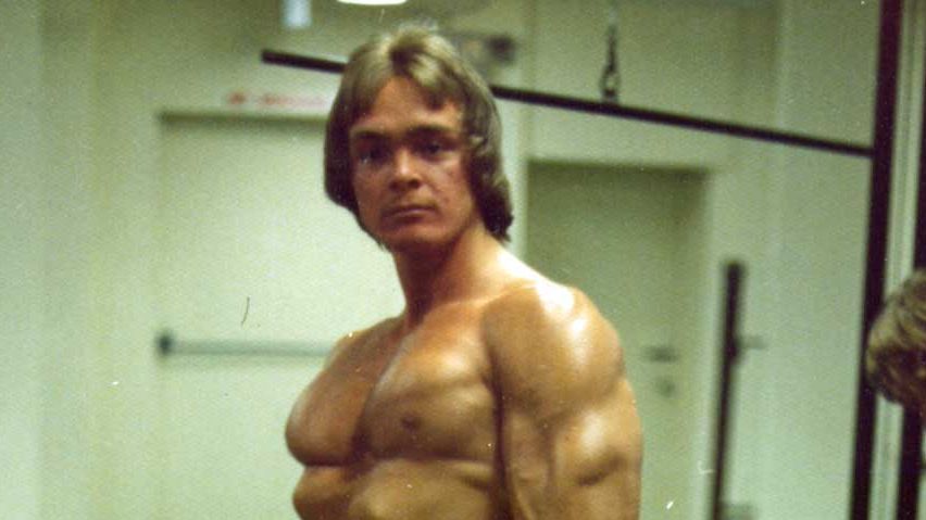 Thor holding a sign for the Universal Olympic Gym