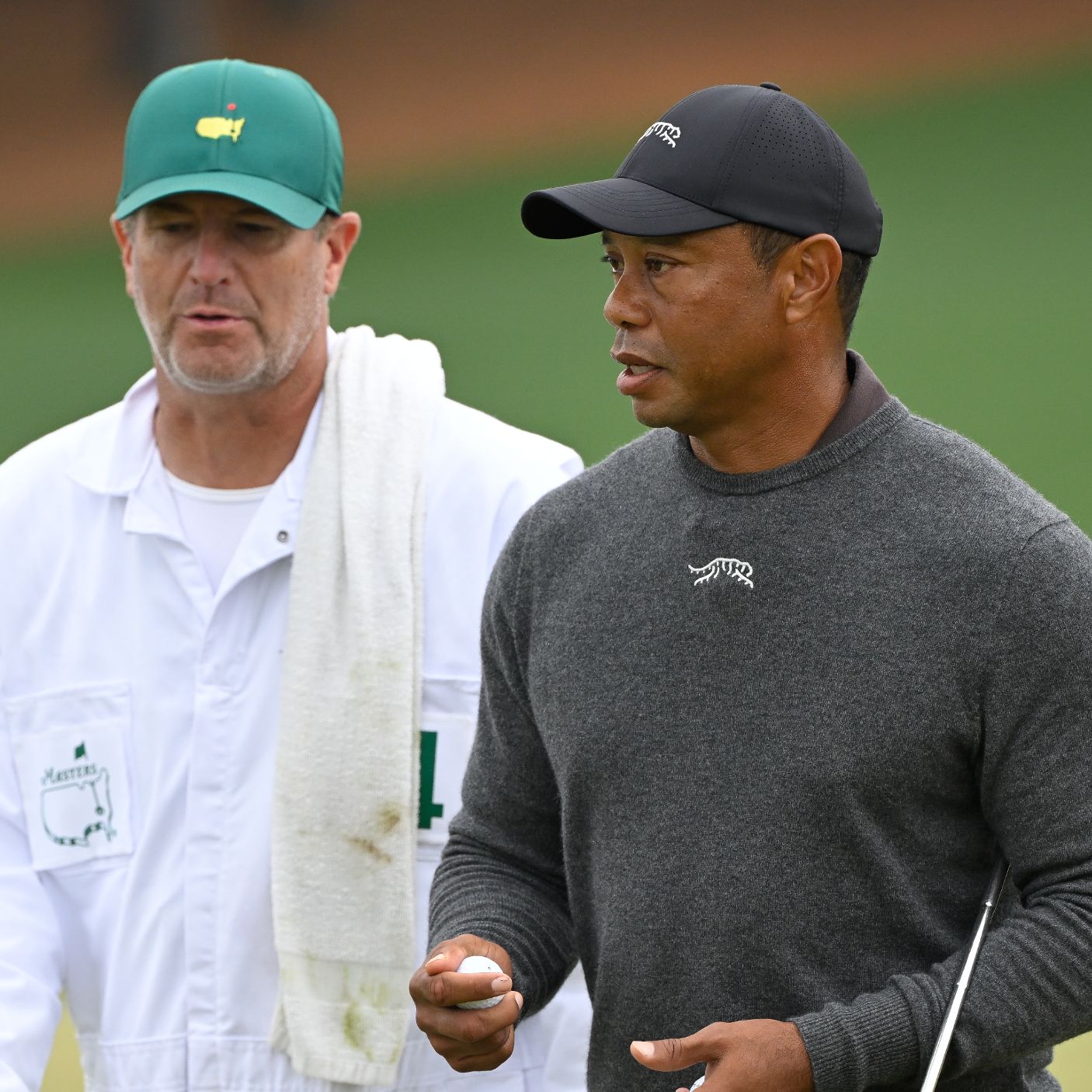 tiger woods cigarette caddy and his caddie check the wind direction with the smoke from the in 1997 tiger woods cigarette caddy Tiger