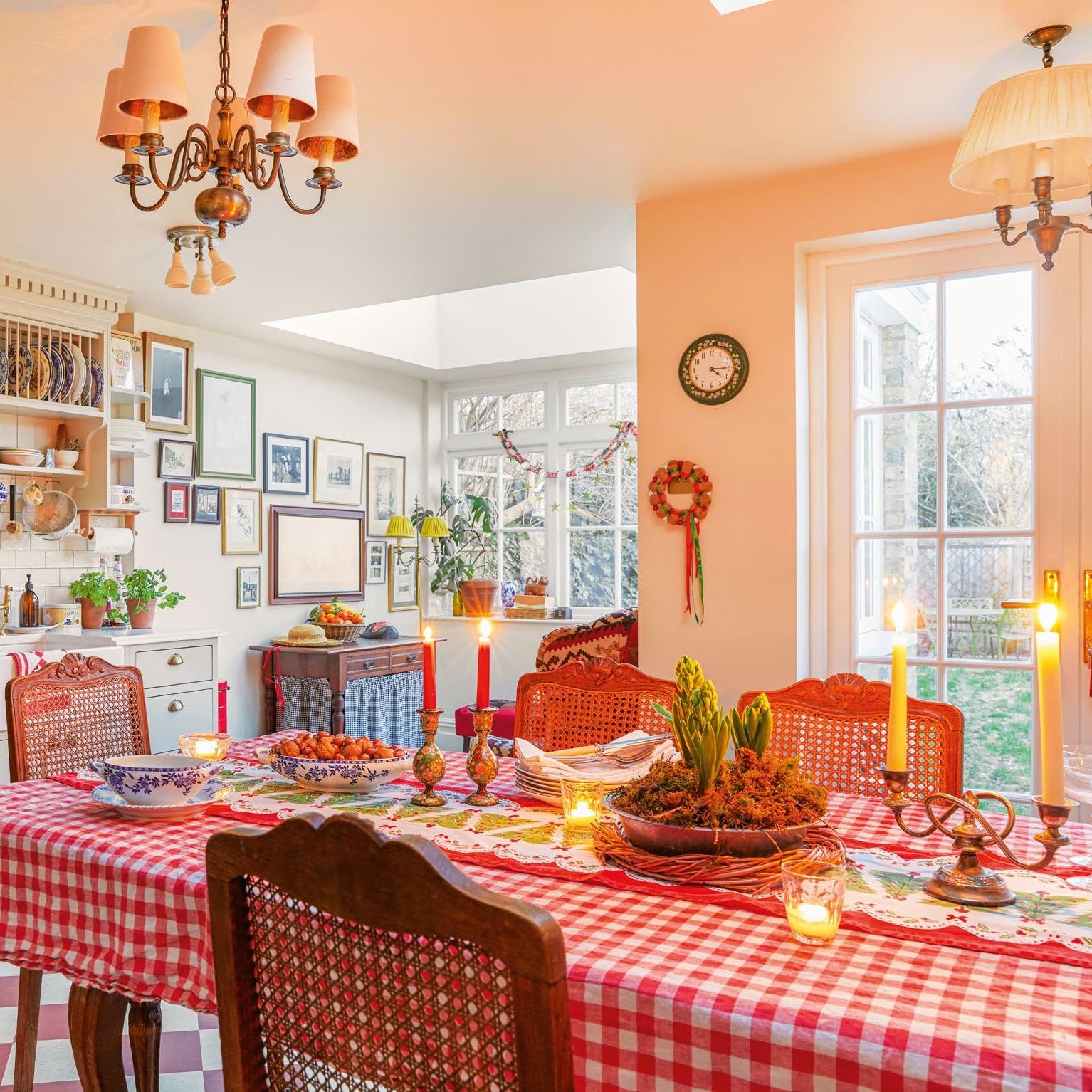 dining table laid with gingham cloth, candles and vintage runner, with antique dining chairs