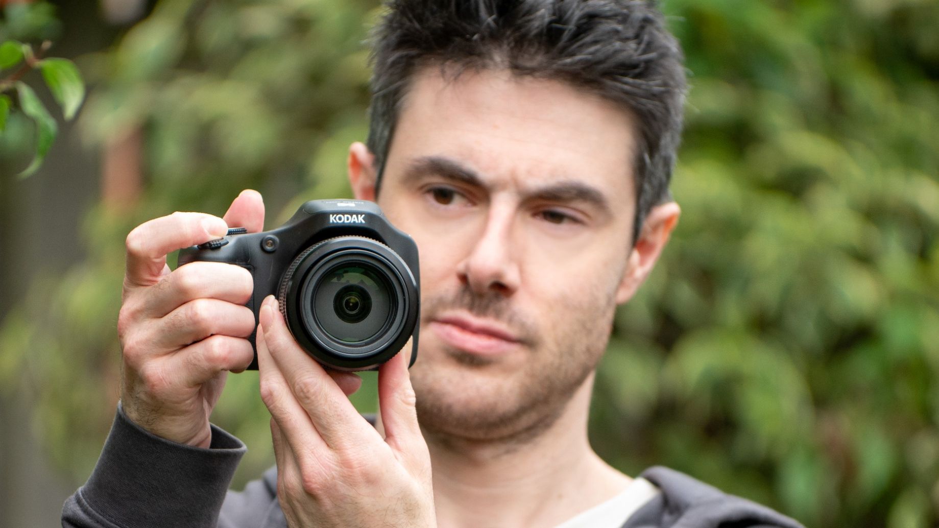 A man with the Kodak Pixpro AZ653 bridge camera