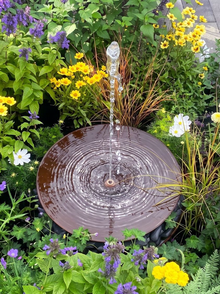 garden water feature in a border